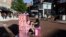 Street Pianos: In this Sunday, Sept. 25, 2016 photo Scott Frazer, of Medford, Mass., plays a piano on the sidewalk in the Harvard Square neighborhood of Cambridge, Mass. A number of working pianos painted by local artists have been placed around Boston and Cambridge, each with a simple message to passersby: "Play Me, I'm Yours." 