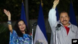 Nicaragua's incumbent president Daniel Ortega and his wife, vice presidential candidate Rosario Murillo, left, wave at supporters after casting their ballots in Managua, Nov. 6, 2016. 