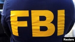 FILE PHOTO: An FBI logo is pictured on an agent's shirt in the Manhattan borough of New York City