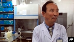 Doctor O Yong Il explains how patients are diagnosed at the National Tuberculosis Reference Laboratory in Pyongyang, North Korea, May 7, 2018.