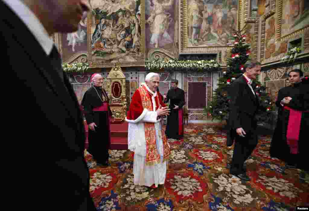 Pope Benedict leaves after an audience with Vatican-accredited diplomats at the Vatican, January 10, 2011. 