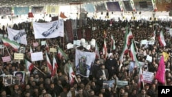 People take part in the funeral of Sanee Zhaleh, a student who was shot dead during an opposition rally in Tehran, February 16, 2011