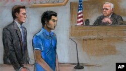 In this courtroom sketch, defendant Dias Kadyrbayev, center, a college friend of Boston Marathon bombing suspect Dzhokhar Tsarnaev, is depicted, Aug. 21, 2014 in federal court in Boston during a hearing.