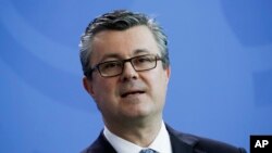 FILE - Prime Minister of Croatia Tihomir Oreskovic attends a news conference with German Chancellor Angela Merkel after talks at the chancellery in Berlin, Germany, March 1, 2016. 