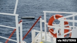 FILE - A rubber boat is seen after it capsized with dozens migrants on board, during a search and rescue operation in the Mediterranean Sea off the Libyan coast, April 22, 2021. (Flavio Gasperini/SOS Mediterranee/Handout via Reuters) 