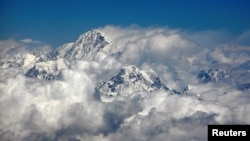 FILE - Mount Everest or Sagarmatha (top), the highest peak in the world with an altitude of 8.848 meters is seen in this aerial view next to Mount Ama Dablam (bottom R) on April 22, 2007. (REUTERS/ Desmond Boylan/File Photo)