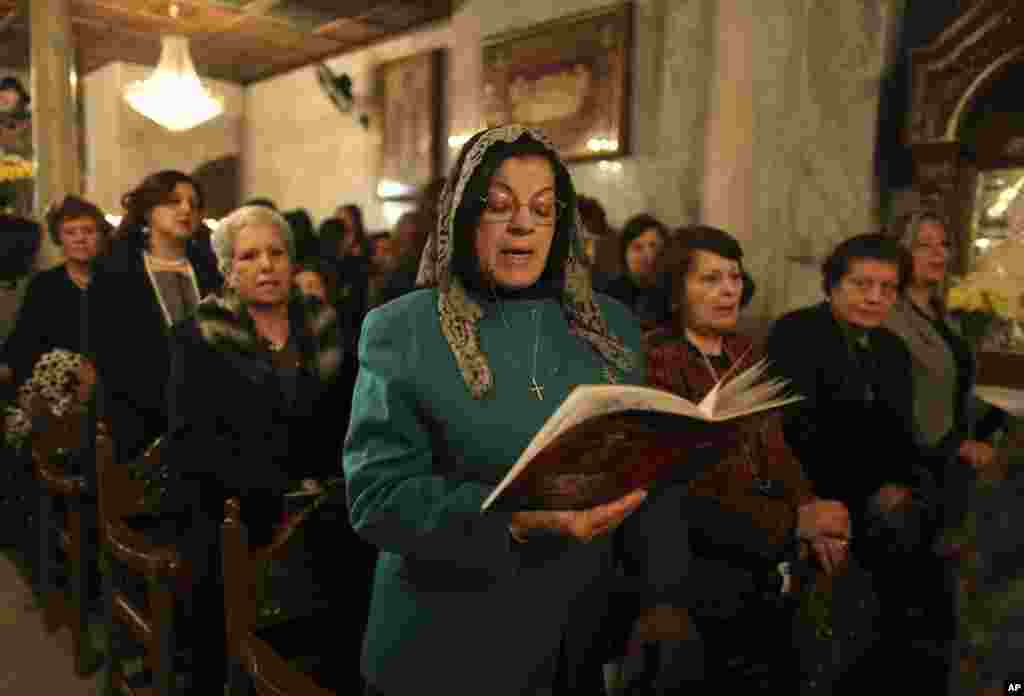 Palestinian Greek Orthodox worshipers attend Christmas services at the Saint Porfirios church in Gaza City, January 7, 2012. (Reuters)