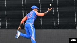 India's Suryakumar Yadav makes a catch to dismiss South Africa's David Miller during the ICC men's Twenty20 World Cup 2024 final cricket match between India and South Africa at Kensington Oval in Bridgetown, Barbados, on June 29, 2024. (Photo by Chandan K