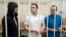 FILE - Lawyers Igor Sergunin, from left, Alexei Liptser and Vadim Kobzev, all who once represented late opposition leader Alexei Navalny, stand in a courtroom in Petushki, Vladimir region, east of Moscow, Jan. 17, 2025.