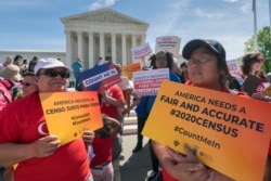 FILE - Immigration activists rally outside the Supreme Court as the justices hear arguments over the Trump administration's plan to ask about citizenship on the 2020 census, in Washington, April 23, 2019.