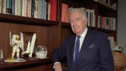 Former CBS anchorman Walter Cronkite poses near space memorabilia in his New York office, 1995