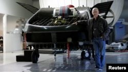 Rafi Yoeli, founder and CEO of Urban Aeronautics, stands next to a prototype of the Cormorant, a drone, at the company's workshop in Yavne, Israel Dec. 22, 2016.