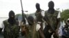 Members of Movement for the Emancipation for the Niger Delta, (MEND) a militant group patrol the creeks in the Niger Delta area of Nigeria, in this Feb. 24, 2006 file photo.