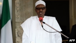 FILE - This file photo taken on May 14, 2016 shows Nigerian President Muhammadu Buhari speaking during a press conference at the Presidential Palace in Abuja.