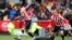 FILE: Brentford's Frank Onyeka, left, challenges for the ball with Arsenal's Kieran Tierney during the English Premier League football match between Brentford and Arsenal, at the Gtech Community stadium, London. Taken 9.18.2022