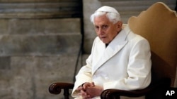 FILE: FILE - In this Tuesday, Dec. 8, 2015. filer, Pope Emeritus Benedict XVI attends a Mass prior to the opening of the Holy Door of St. Peter's Basilica.. 