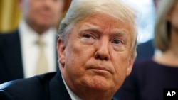 FILE - President Donald Trump listens to a question during a signing ceremony at the White House.