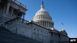 A U.S. flag flies near the dome of the U.S. Capitol in Washington, Feb. 25, 2025. 