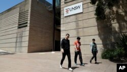 FILE - Students walk around the University of New South Wales campus in Sydney, Australia, Tuesday, Dec. 1, 2020. Australia’s government has invited backpackers and students to seek work in the country. (AP Photo/Mark Baker)