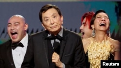James Hong, Michelle Yeoh and Brian Le gesture as they accept the Outstanding Performance by a Cast in a Motion Picture award for "Everything Everywhere All at Once" during the 29th Screen Actors Guild Awards in Los Angeles, California, Feb. 26, 2023.
