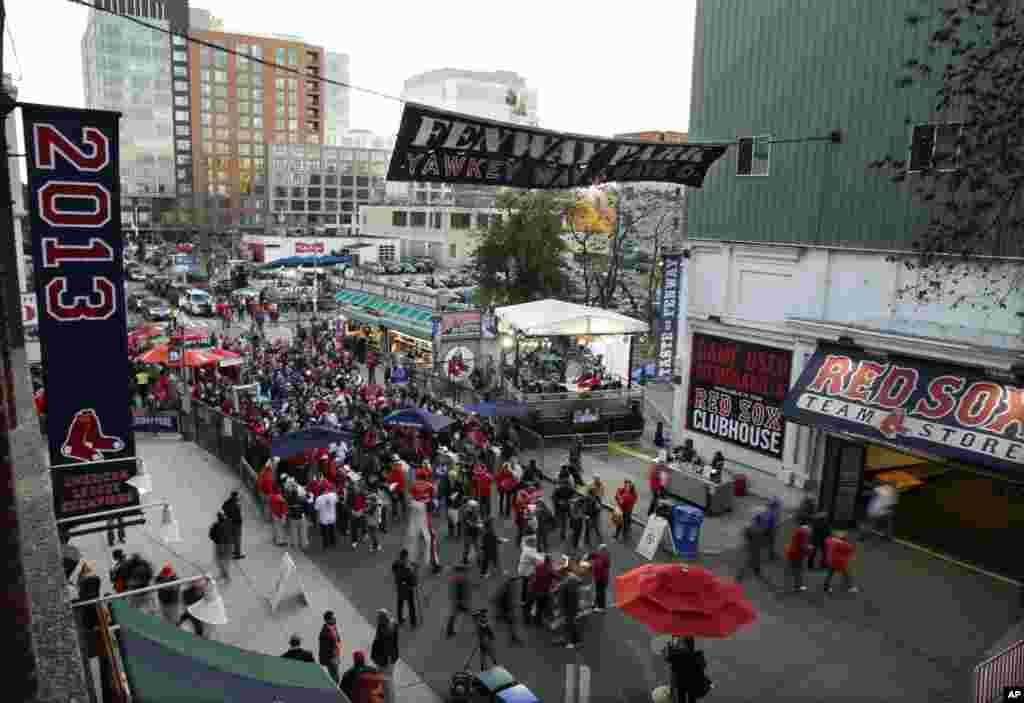 Fans make their way into Fenway Park before baseball's World Series, Oct. 24, 2013, in Boston.