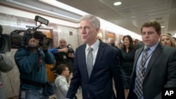 Supreme Court nominee Neil Gorsuch arrives for a meeting with Sen. Susan Collins, R-Maine, on Capitol Hill in Washington, Feb. 9, 2017. Gorsuch has said he found President Donald Trump's attacks on the judiciary "disheartening" and "demoralizing."