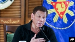 FILE - Philippine President Rodrigo Duterte attends a meeting with members of the Inter-Agency Task Force on the Emerging Infectious Diseases in Davao province, southern Philippines, Aug. 17, 2020.