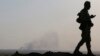 FILE - Smoke rises from a U.S. air strike on Islamic State militant positions in Khazir, on the edge of Mosul, Sept. 16, 2014. 