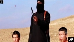 Video yang diunggah ISIS tentang penyanderaan Kenji Goto dan Haruna Yukawa (Foto: screen grab). 