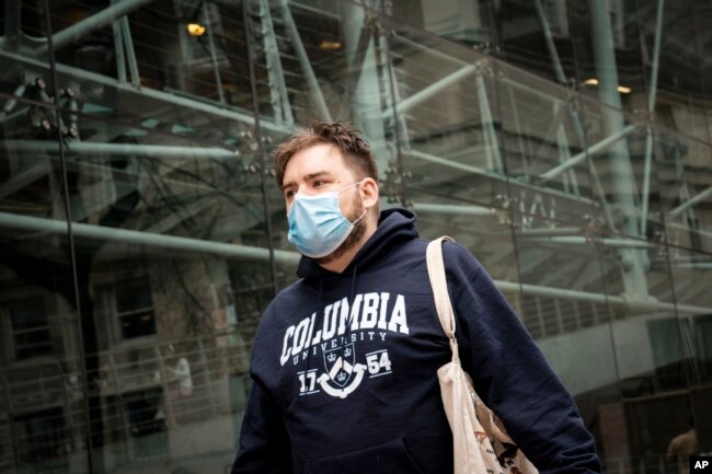 A student walks on the Columbia University campus in New York. (AP Photo/John Minchillo)