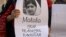 An activist from non-governmental organization Insani Haqooq Ittihad holds a picture of Malala Yousufzai during a demonstration in Islamabad October 10, 2012. 