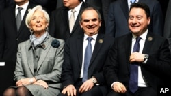 From left: Managing Director of the International Monetary Fund, Christine Lagarde, with Turkey's Deputy Prime Minister Ali Babacan and Turkey's Central Bank Governor Erdem Basci during a meeting of the finance ministers and central bankers from the Group of 20 in Istanbul, Turkey, Feb. 10, 2015. 