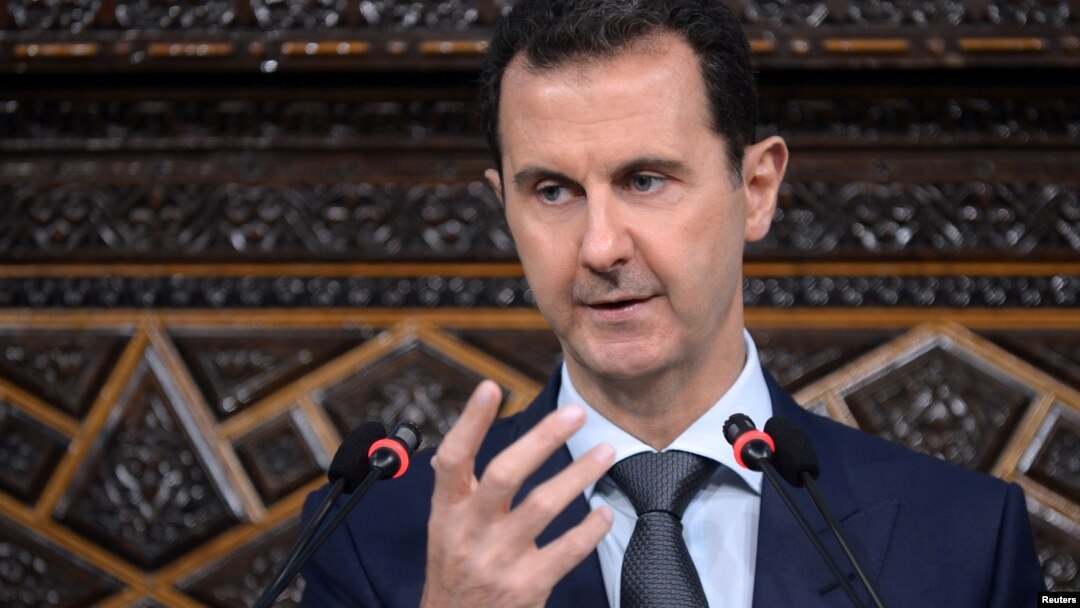 Syrian President Bashar al-Assad speaks to Parliament members in Damascus in this photo handed out by SANA, the Syrian Arab News Agency, June 7, 2016.