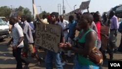Suspected MDC youths demonstrate in Harare demanding an election re-run