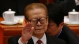 FILE - Former Chinese President Jiang Zemin gestures during the opening session of the 18th Communist Party Congress held at the Great Hall of the People in Beijing, China, Nov. 8, 2012. 