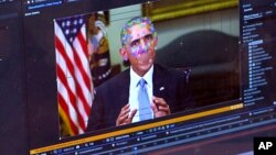 This image made from video of a fake video featuring former President Barack Obama shows elements of facial mapping used in new technology that lets anyone make videos of real people appearing to say things they've never said. (AP Photo)