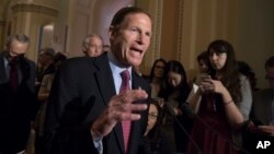 FILE - Sen. Richard Blumenthal, D-Conn., responds to questions from reporters about President Donald Trump reportedly sharing classified information with two Russian diplomats during a meeting in the Oval Office on Capitol Hill in Washington, May 16, 2017.