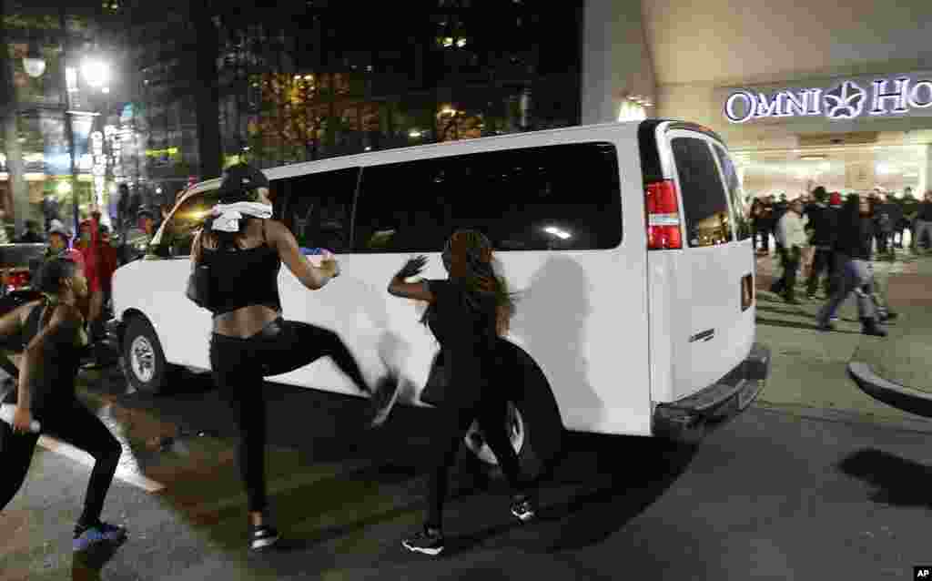 Demonstrators protest Tuesday's fatal police shooting of Keith Lamont Scott in Charlotte, N.C. on Sept. 21, 2016. Officers fired tear gas to disperse the crowd.