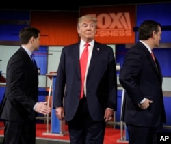 Republican presidential candidate, businessman Donald Trump stands on the stage before the Fox Business Network Republican presidential debate at the North Charleston Coliseum, Thursday, Jan. 14, 2016.