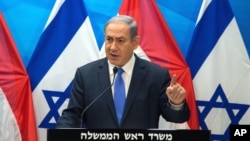 Israel's Prime Minister Benjamin Netanyahu speaks during a press conference with Dutch Foreign Minister Bert Koenders at the Prime Minister's office in Jerusalem, July 14, 2015. 