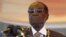 FILE: President Robert Mugabe waits to address crowds gathered for Zimbabwe's Heroes Day commemorations in Harare, August 10, 2015.
