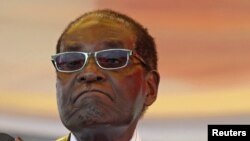 President Robert Mugabe waits to address crowds gathered for Zimbabwe's Heroes Day commemorations in Harare, August 10, 2015.