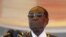 FILE - President Robert Mugabe waits to address crowds gathered for Zimbabwe's Heroes Day commemorations in Harare, August 10, 2015.