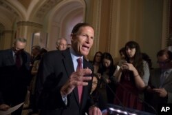 FILE - Sen. Richard Blumenthal, D-Conn., responds to questions from reporters on May 6, 2019.