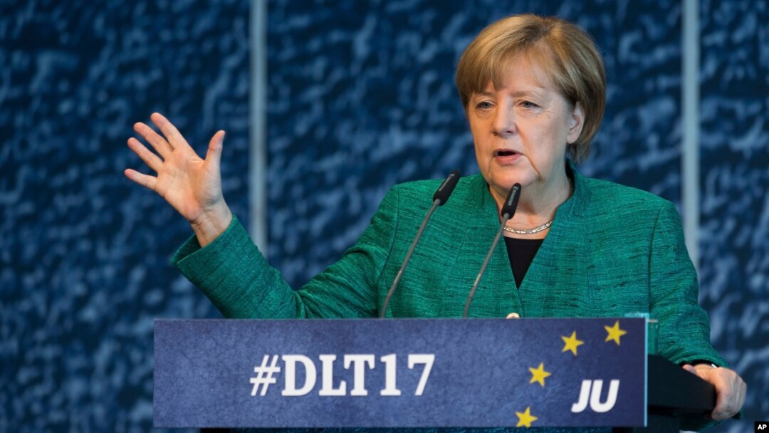 German Chancellor Angela Merkel of the Christian Democrats delivers a speech during a meeting oh her party's youth wing in Dresden, Germany, Oct. 7, 2017.