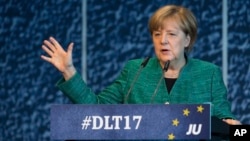 German Chancellor Angela Merkel of the Christian Democrats delivers a speech during a meeting oh her party's youth wing in Dresden, Germany, Oct. 7, 2017.