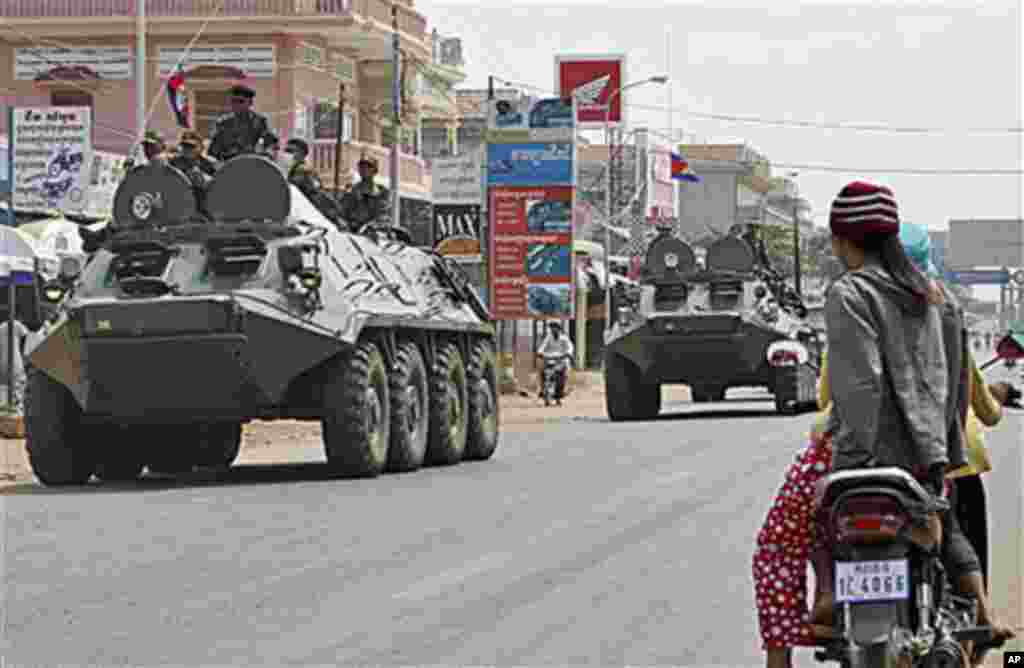 Armored personnel carriers of Cambodian Army drive through a road at Kampong Thom town, about 168 kilometers north of Phnom Penh, Cambodia - neighboring province to Preah Vihear of disputed 11th century Hindu Preah Vihear temple near border between Cambod