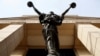 The statue of Lady Justice stands at the Federal Courthouse in Alexandria, Va., Aug. 17, 2018.