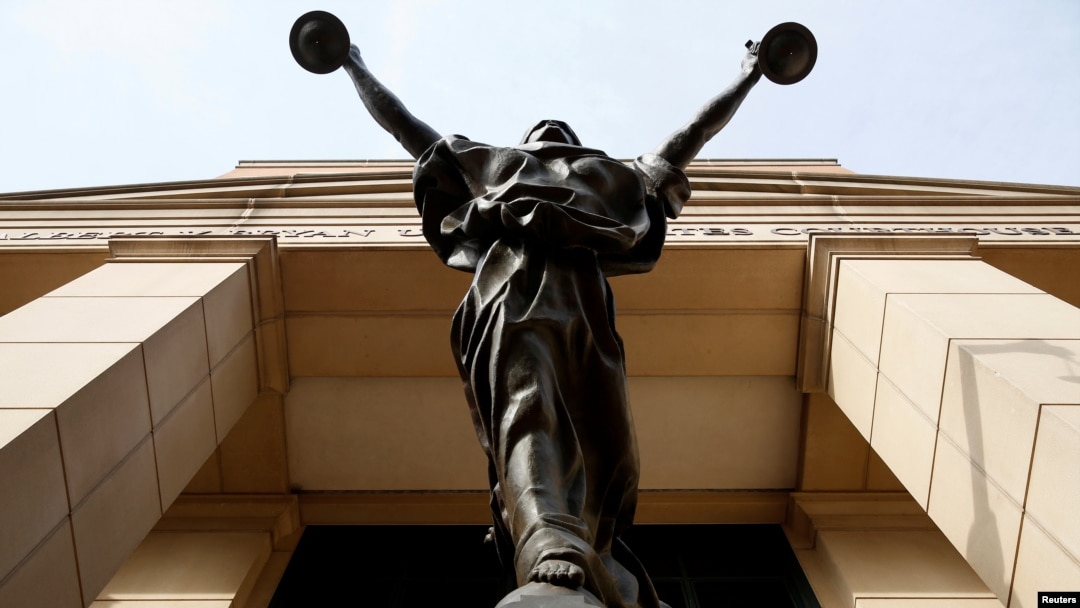 The statue of Lady Justice stands at the Federal Courthouse in Alexandria, Va., Aug. 17, 2018.