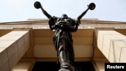 The statue of Lady Justice stands at the Federal Courthouse in Alexandria, Va., Aug. 17, 2018.